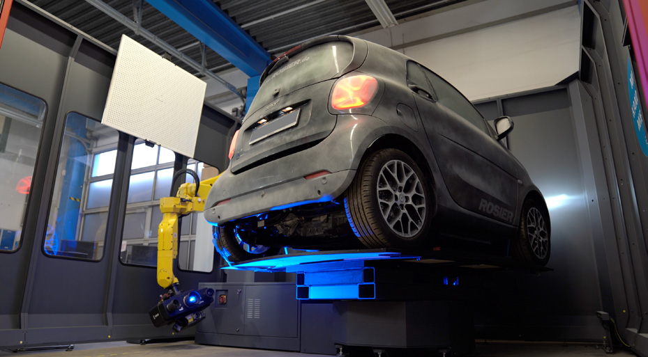 AESUB Green liquid being applied via spray gun to a large vehicle for 3D scanning preparation