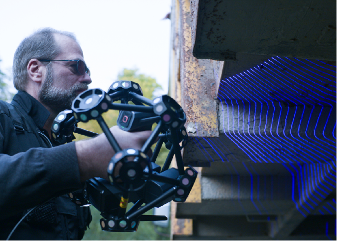 SHINING 3D FreeScan Trak ProW+ marker-free blue-laser scanning — no coded targets stuck to the part surface