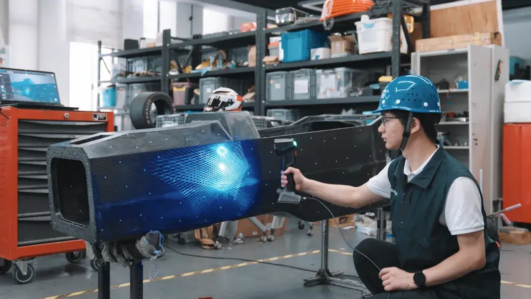 FreeScan UE Pro2 inspecting an automotive monocoque assembly wirelessly &mdash; lab-cert audit-grade metrology without the cable